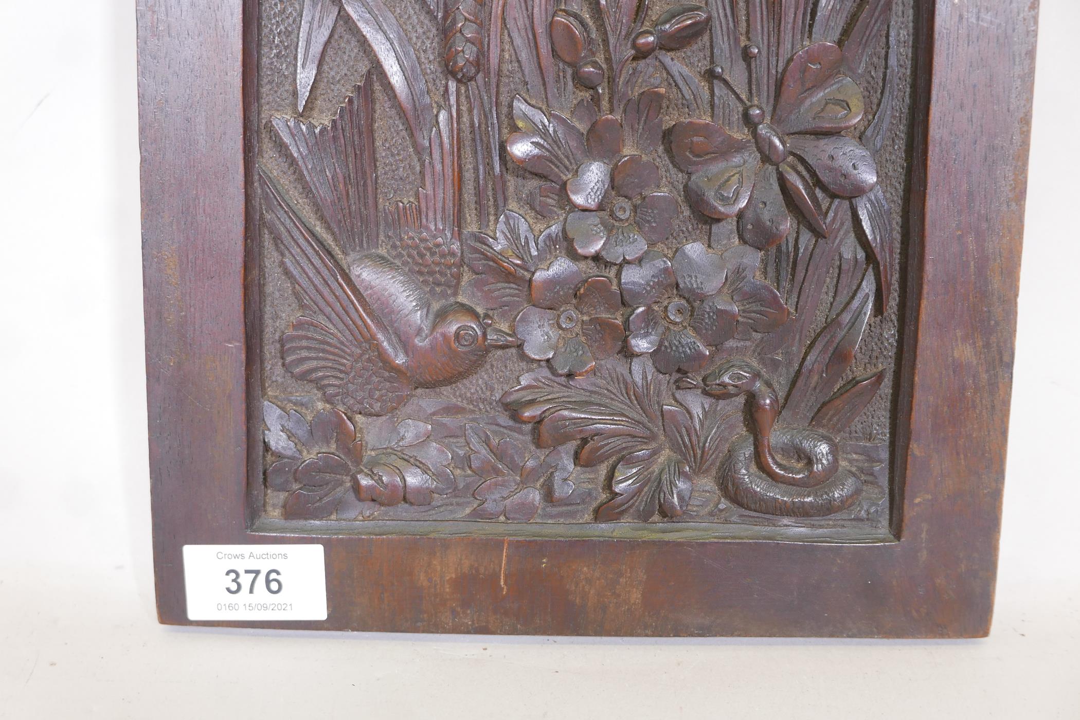 An antique mahogany panel, well carved with a serpent, bird and butterfly under reeds, 12" x 9" - Image 2 of 3