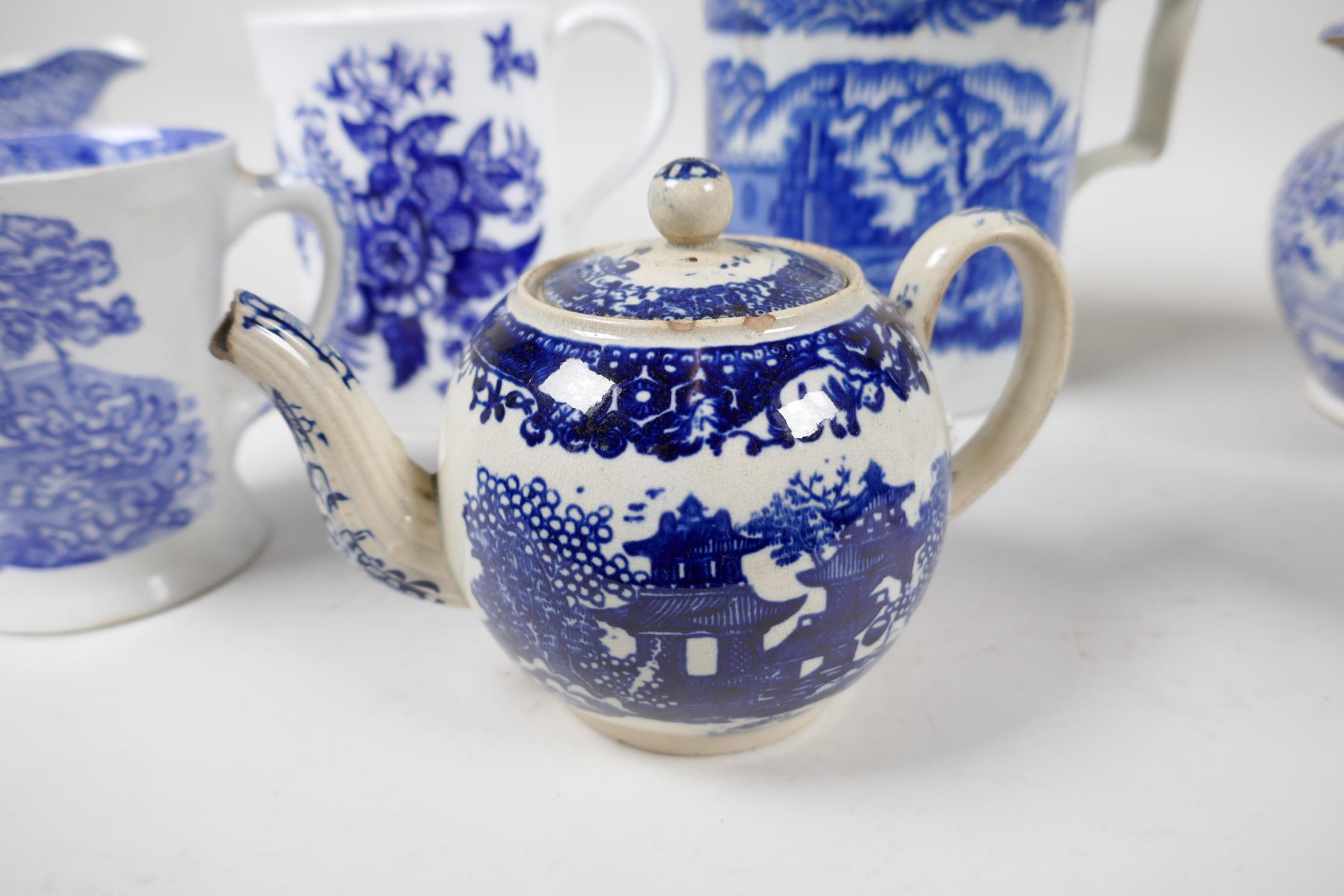 A collection of early C19th blue and white pottery mugs, jugs and small teapot - Image 3 of 8