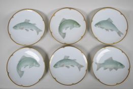 A set of six German 'Thomas' porcelain fish plates with shaped and gilt rims, 9" diameter