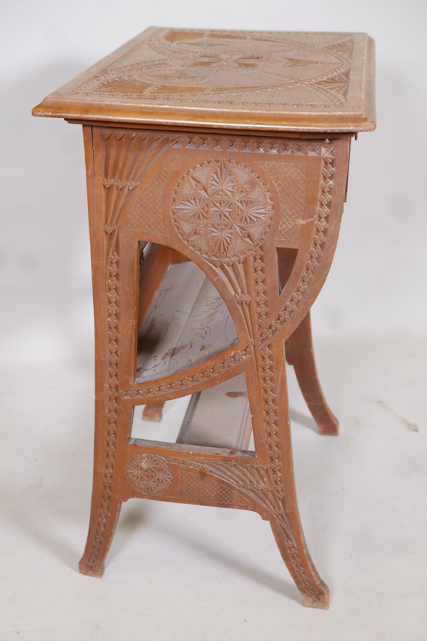 A satin walnut canterbury with carved Moorish Liberty style decoration and single drawer, A/F, - Image 4 of 4