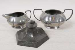 An Arts & Crafts pewter inkwell by Talbot Pewter Co, 4½" wide, together with a Tudric pewter sugar