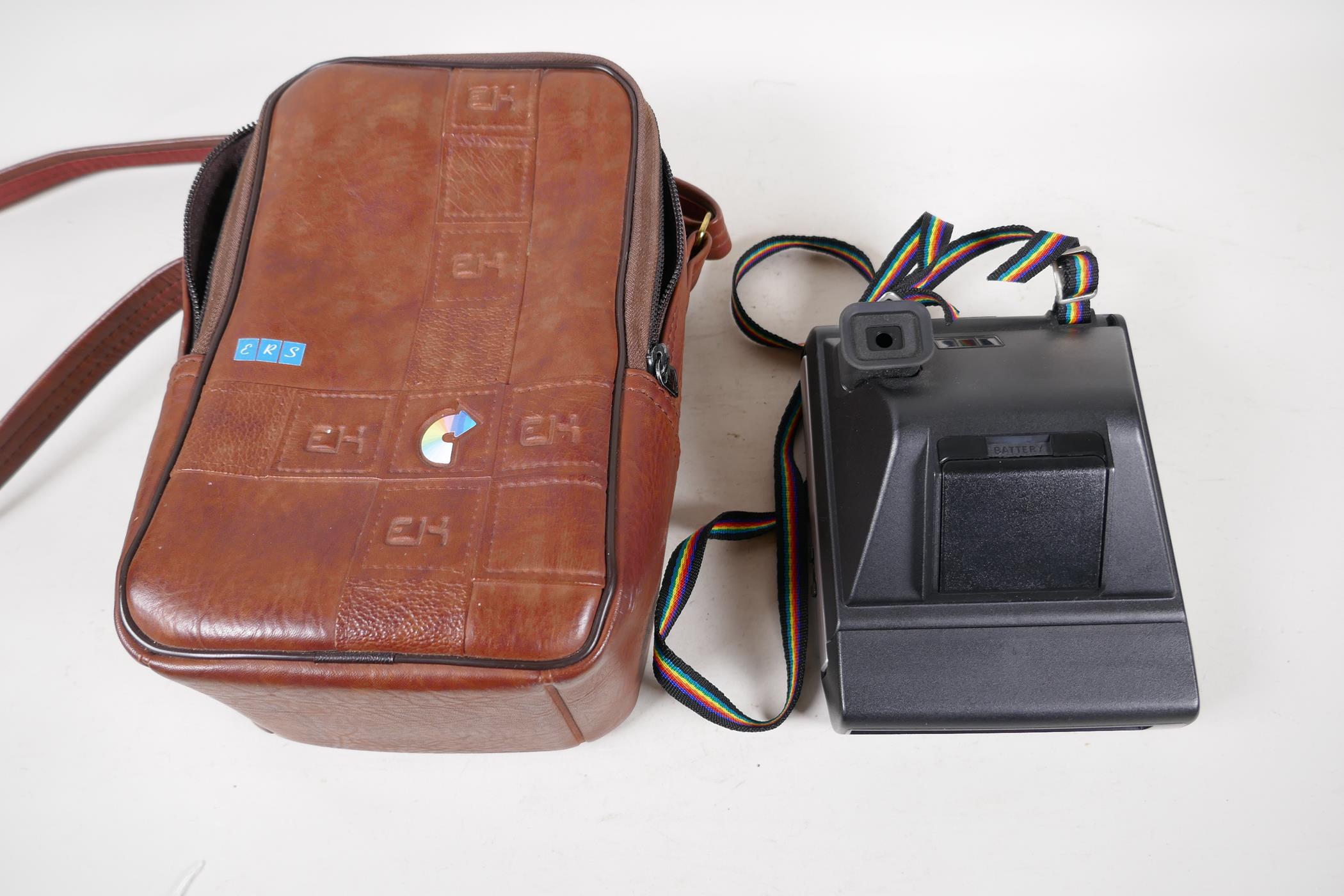 A Kodak Colourburst instant camera in original leather case