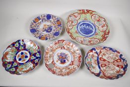 A C19th Imari porcelain charger painted with figures 12" diameter, together with an oval dish