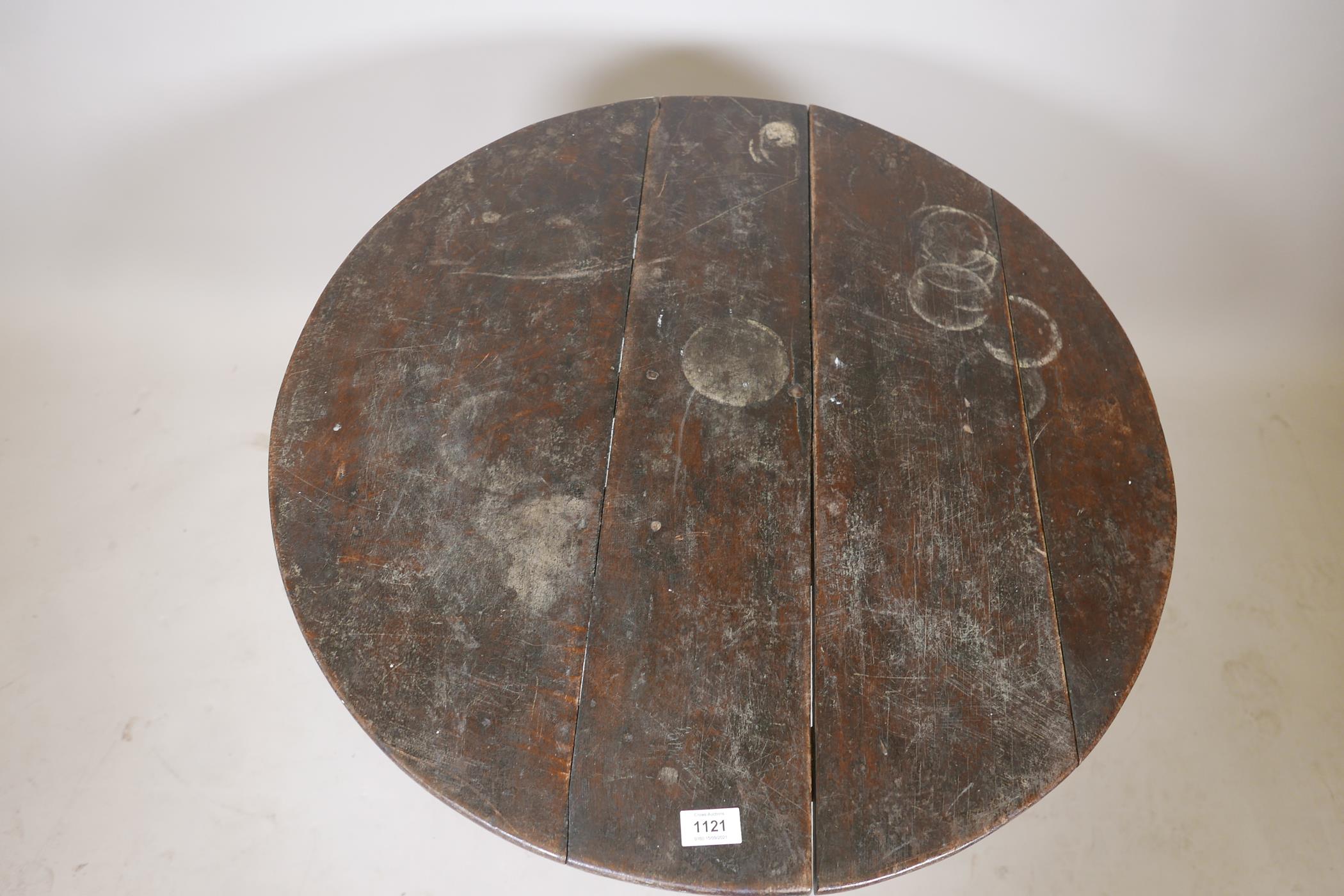An C18th oak tilt top table raised on a turned column and tripod supports, (top fixed), 30" diameter - Image 3 of 4