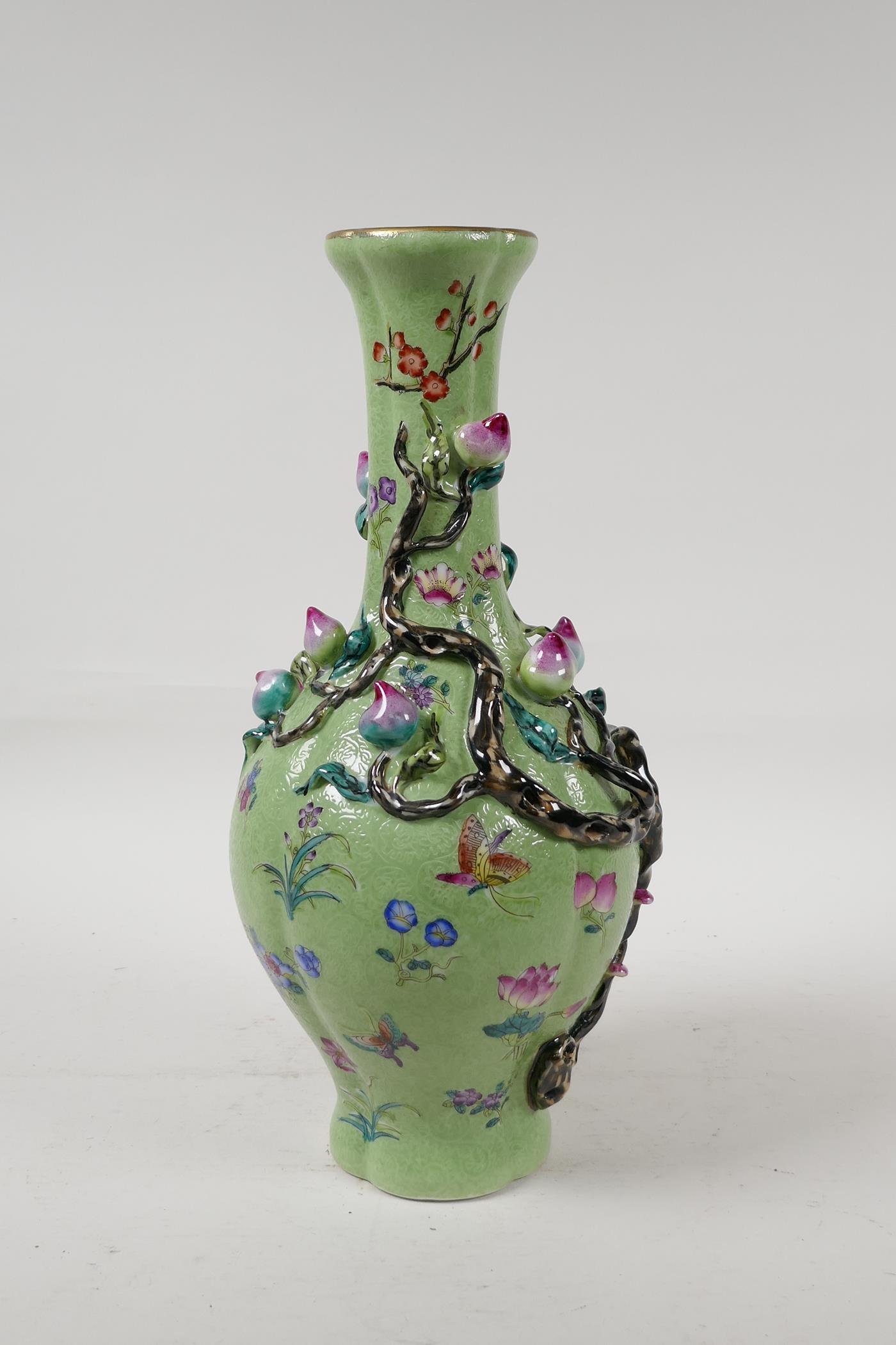 A Chinese polychrome porcelain vase with applied peach tree decoration on a green ground, seal - Image 4 of 6