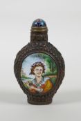 A Chinese repousse copper snuff bottle with two enamelled decorative panels depicting European