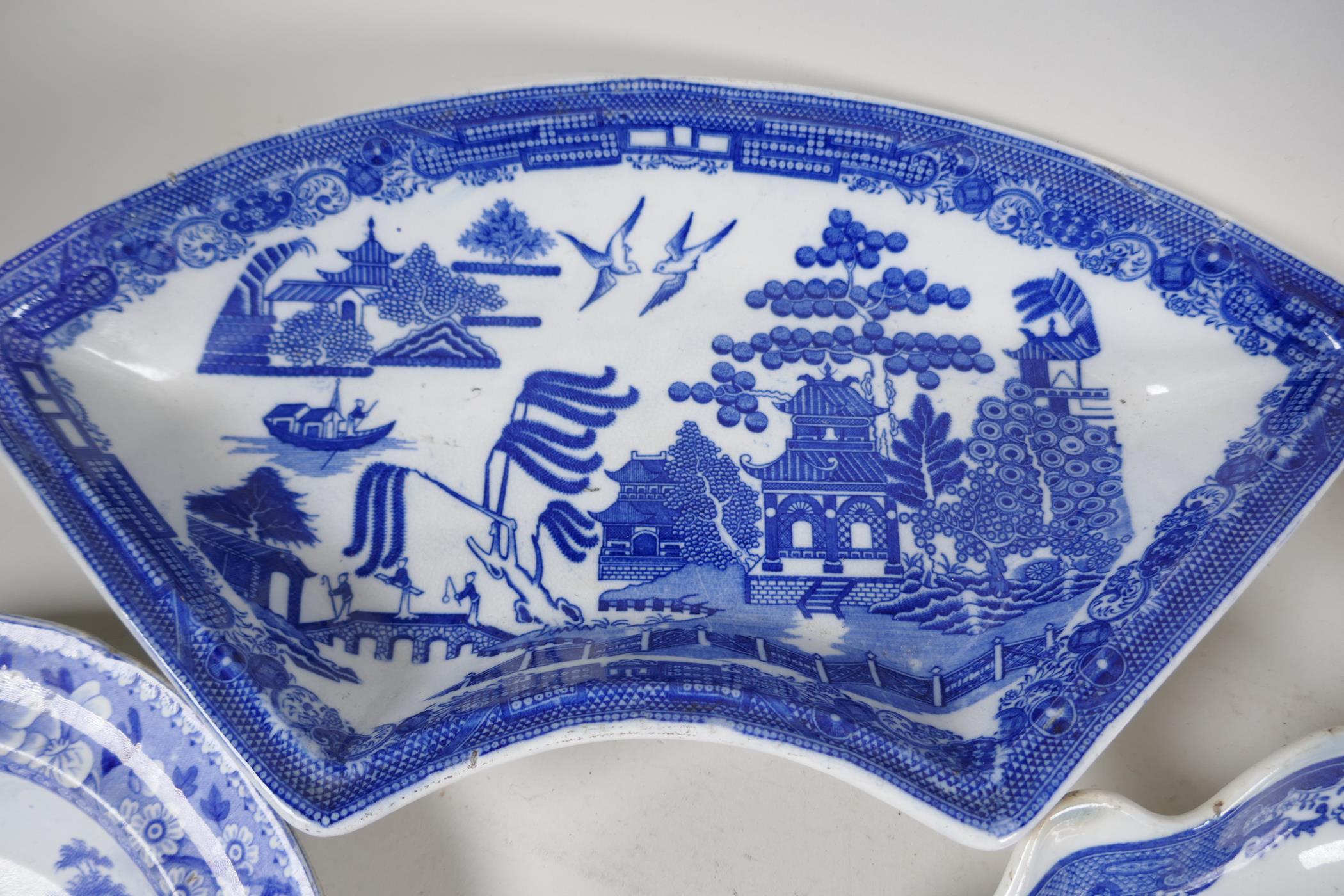 A quantity of C19th blue and white pottery to include a crescent shaped tureen, 13" wide, a petal - Image 3 of 4