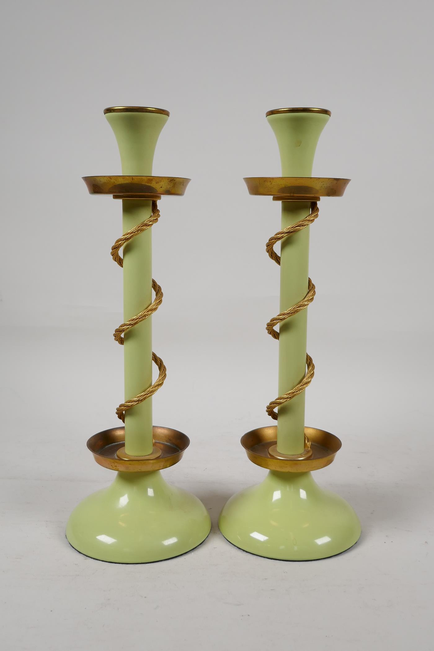 A pair of Bilston enamel candle sticks, the stem entwined with gilt metal ropework, 11½" high