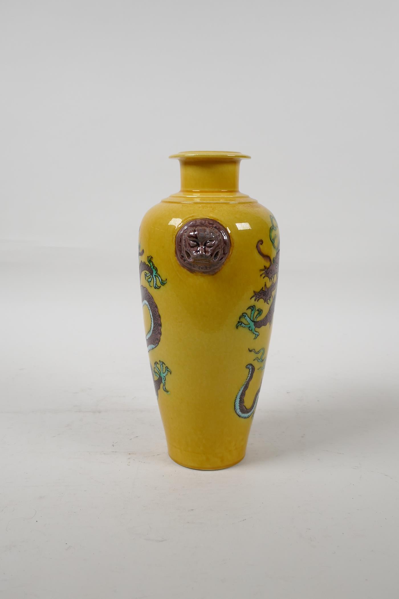 A Chinese Sancai glazed porcelain vase with two lion mask handles and dragon decoration, six - Image 2 of 5