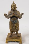 A Sino Tibetan gilt bronze figure of Buddha, 9" high