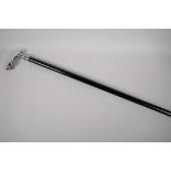 An ebonised walking stick with chromium plated Jaguar mascot handle, 36" long
