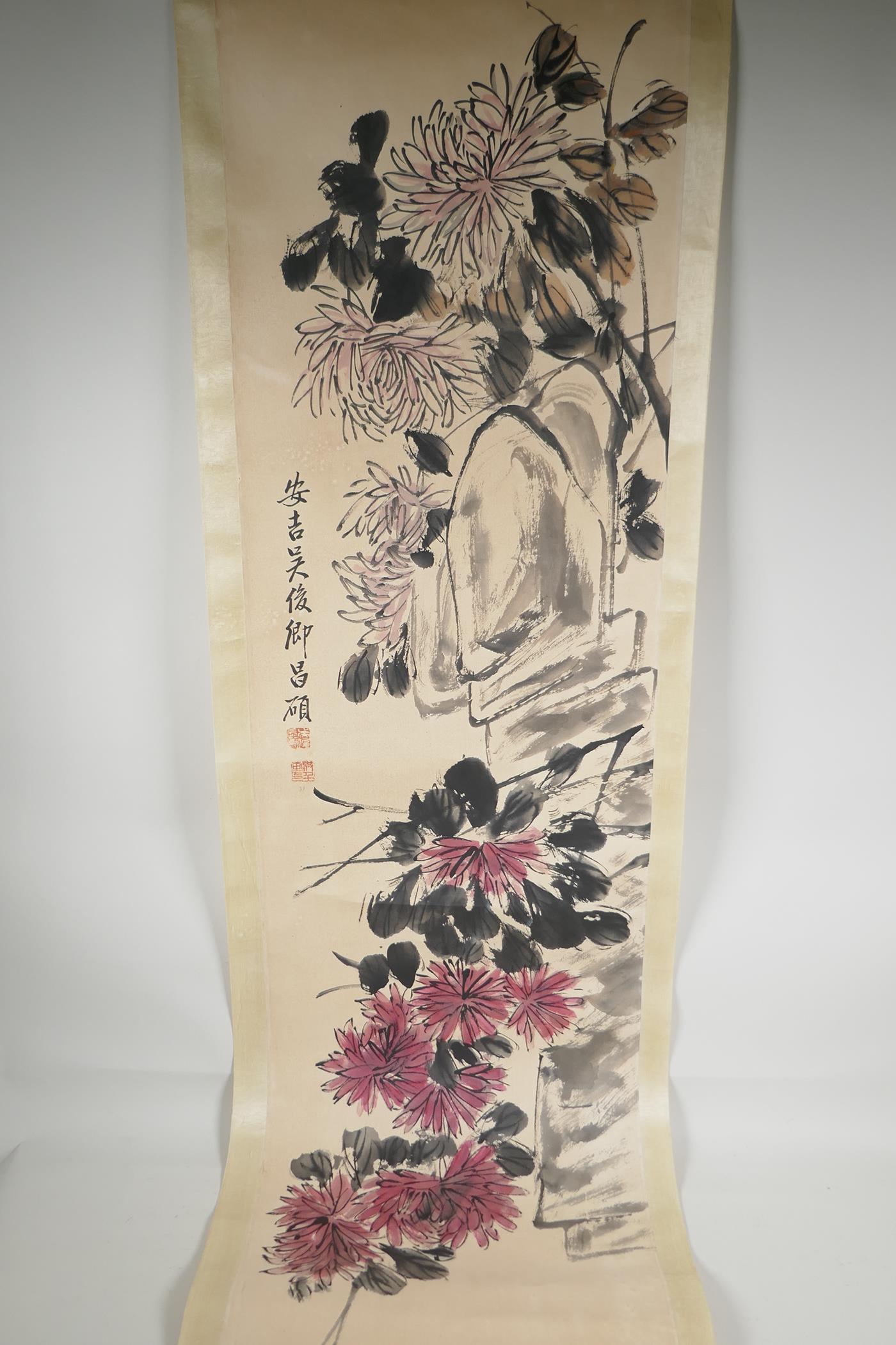 A Chinese watercolour scroll, depicting chrysanthemums, 13" x 53"