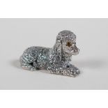 A miniature sterling silver figure of a toy poodle, 1" long