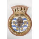 A cast aluminium ship's plaque from HMS Alfriston, 9" long on a wooden shield