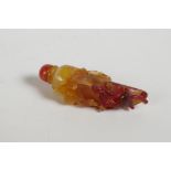 A Chinese agate snuff bottle in the form of a chilli with carved bat and kylin decoration, 3" high