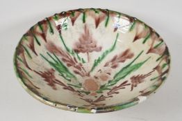 An antique Persian ship glazed wash bowl, 13½" diameter, (very A/F)