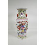 A Chinese polychrome porcelain hexagonal shaped vase, with two mask handles, decorated with warriors