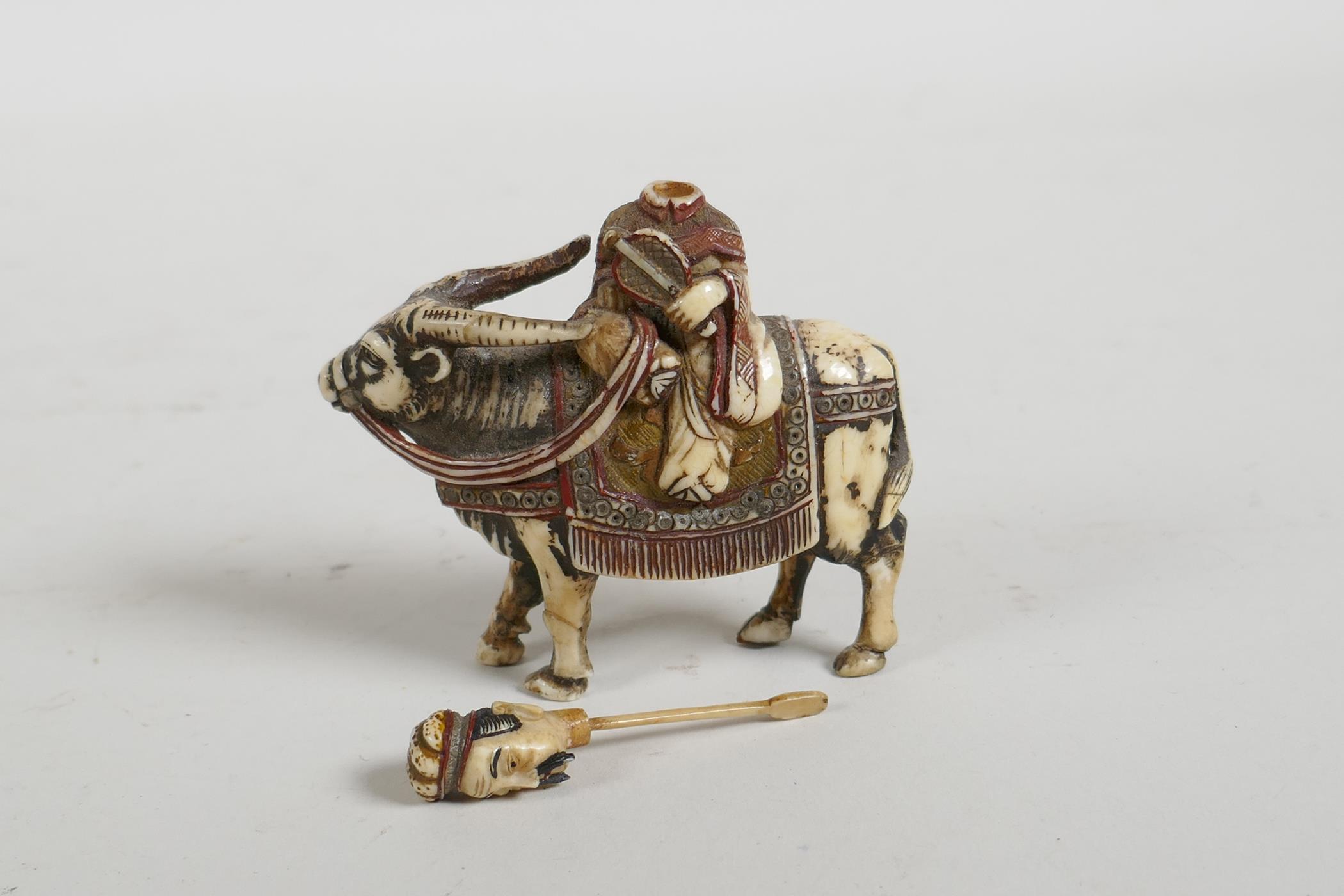 A C19th carved and stained bone snuff bottle in the form of a Chinese man riding a yak, 3" high - Image 2 of 5