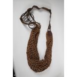 A rare antique gamekeeper's hand woven keep-bag, 34" long, on leather shoulder strap