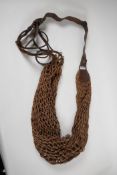 A rare antique gamekeeper's hand woven keep-bag, 34" long, on leather shoulder strap