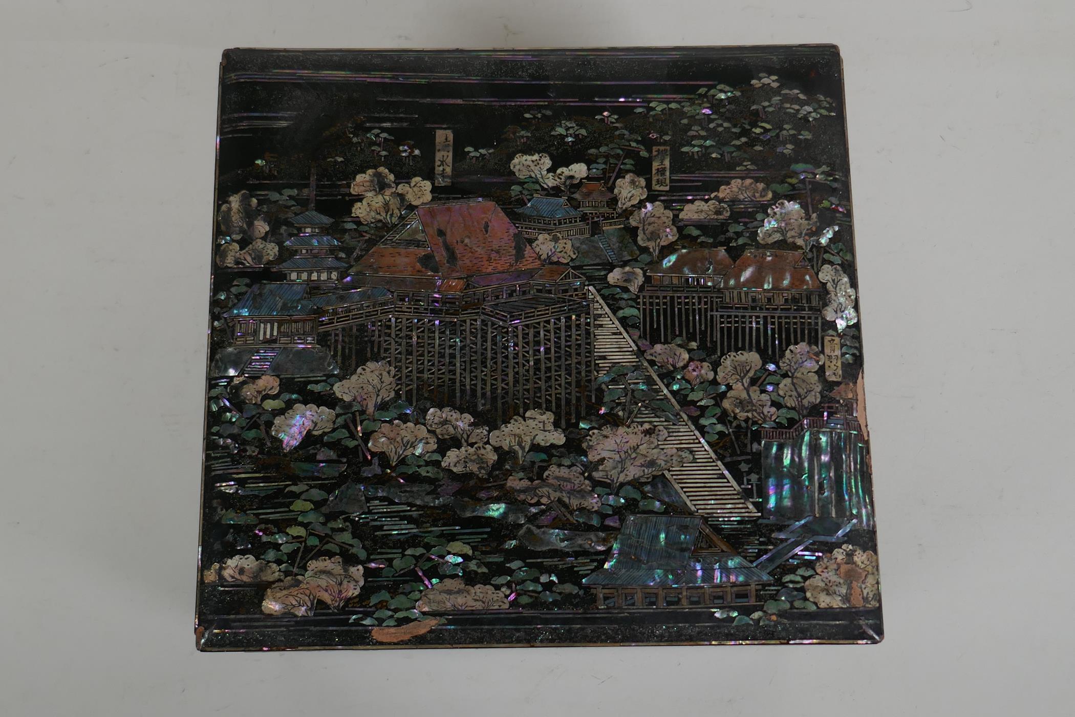 A Japanese Mother of Pearl inlaid black lacquer multi layer box, decorated with views of riverside - Image 2 of 6