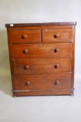 A C19th mahogany chest of two short over three  graduated long drawers, with turned bun handles,