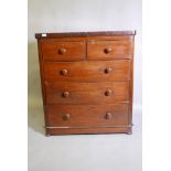 A C19th mahogany chest of two short over three  graduated long drawers, with turned bun handles,