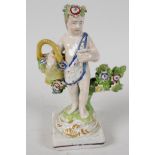 An C18th Staffordshire figurine of a flower seller, 4"