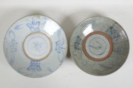 An oriental blue & white porcelain dish, and another, later painted mark to base, 10½" diameter