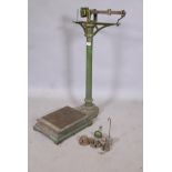 A set of Victorian cast iron scales with weights, 35" high