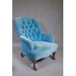 A Victorian button back easy chair in blue velvet, 34" high