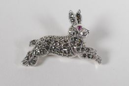 A sterling silver & marcasite brooch in the form of a lizard, 3" long