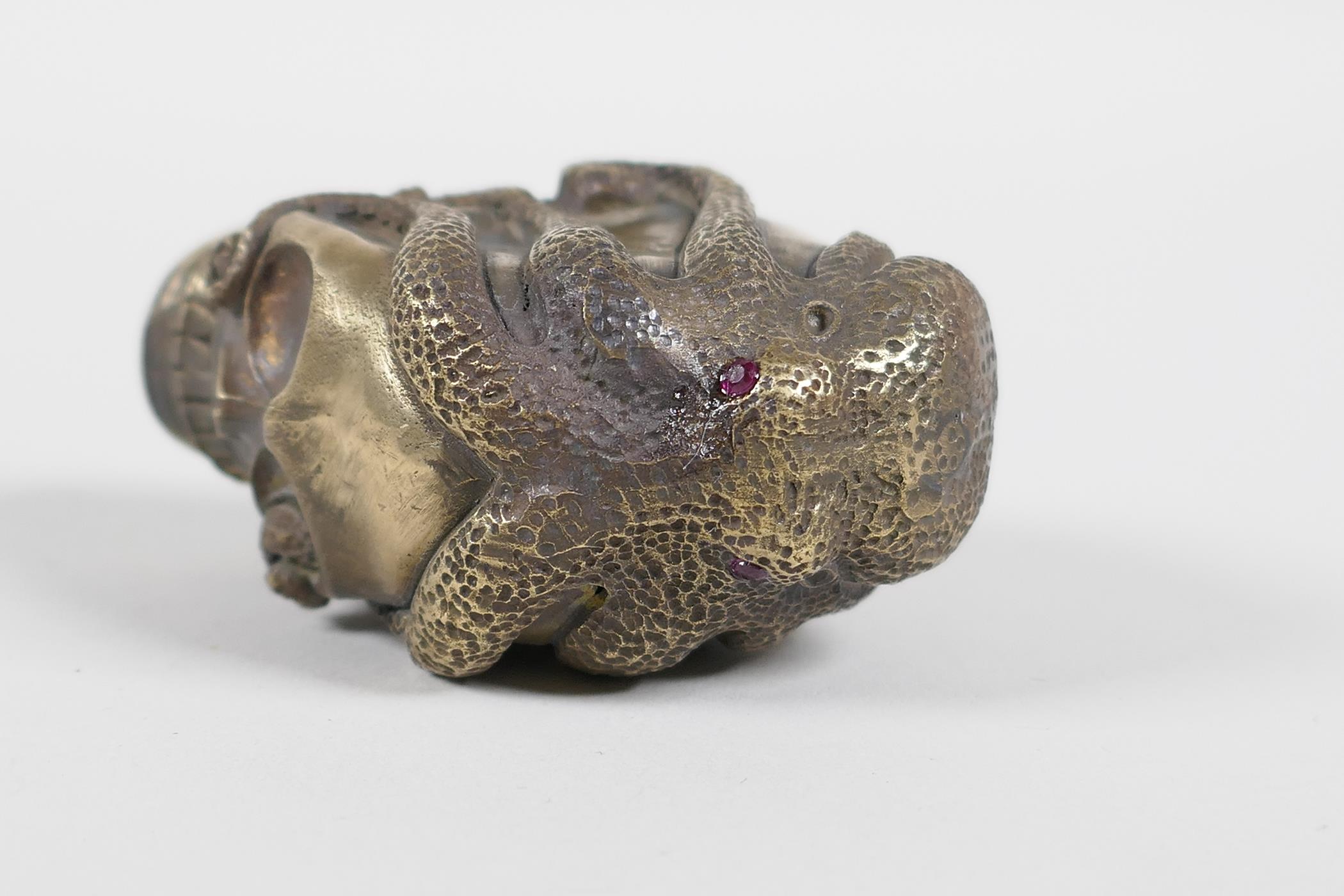 A brass vesta case in the form of an octopus atop a skull - Image 3 of 4