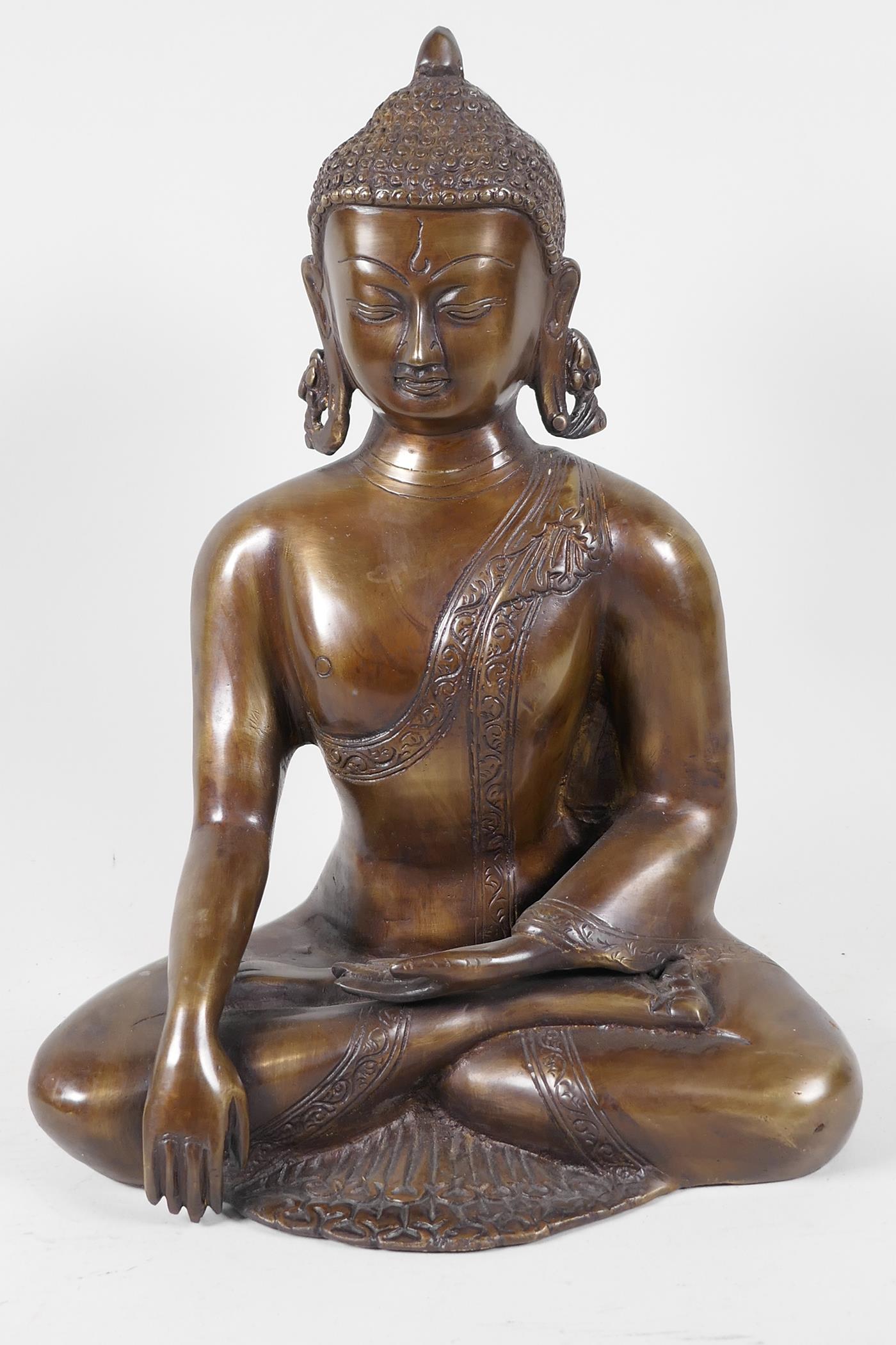 A Chinese bronze figure of Buddha, seated in meditation