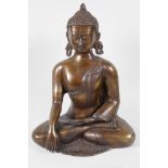 A Chinese bronze figure of Buddha, seated in meditation
