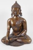 A Chinese bronze figure of Buddha, seated in meditation