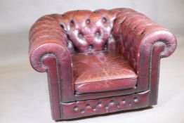 A button back leather Chesterfield style club chair