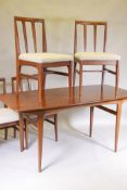A mid century 'Fonseca' afromosia dining table with four chairs ensuite by A. Younger Ltd for Heals,