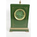 A painted wood cased mantel clock with painted dial and applied Roman numerals, the movement