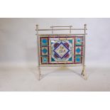 A Victorian Arts & Crafts leaded glass fire screen, the brass frame with maker's plate, 24" x 26",