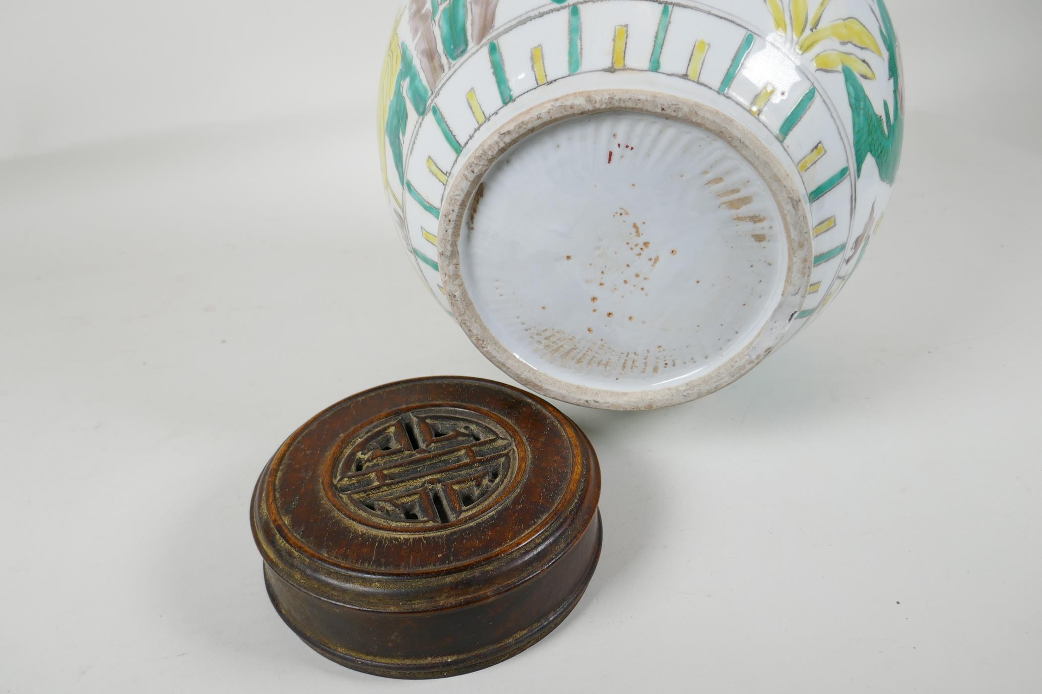 A Chinese Sancai glazed porcelain ginger jar with a turned wood cover, decorated with figures riding - Image 7 of 8