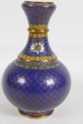 A Chinese cloisonne vase of bulbous form, decorated with geometric designs, 6" high