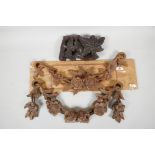 Two carved wooden garlands, 13" wide and an antique carved oak fragment