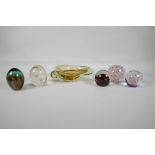 A quantity of art glass paperweights, including one signed Langham, and a Murano amber glass dish,