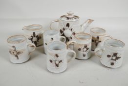 A studio pottery coffee service, comprising coffee pot, cream jug and six cups, by Michael & Barbara