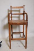 A C19th fruitwood correction chair on square tapered supports, seat 22" high
