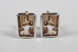 A pair of sterling silver cufflinks, set with cold enamel plaques depicting Victorian erotica