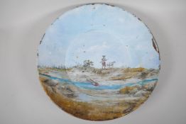A metal prospectors pan, with painted decoration of  a native American and a prospector, signed