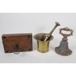 An antique iron lock, with key,  a C19th brass mortar and pestle, and a cast iron door stop, 7½"