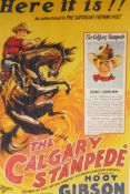 A framed film advertising poster for 'The Calgary Stampede', starring Hoot Gibson, directed by